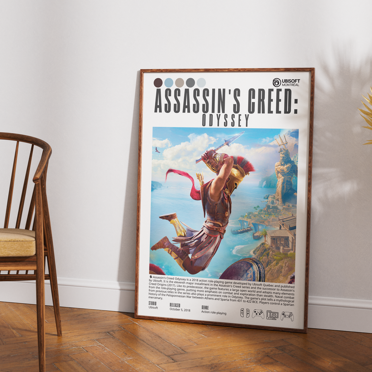 A framed Assassin's Creed: Odyssey art print leaning against a white wall on a wooden floor, with part of a wooden chair visible on the left.