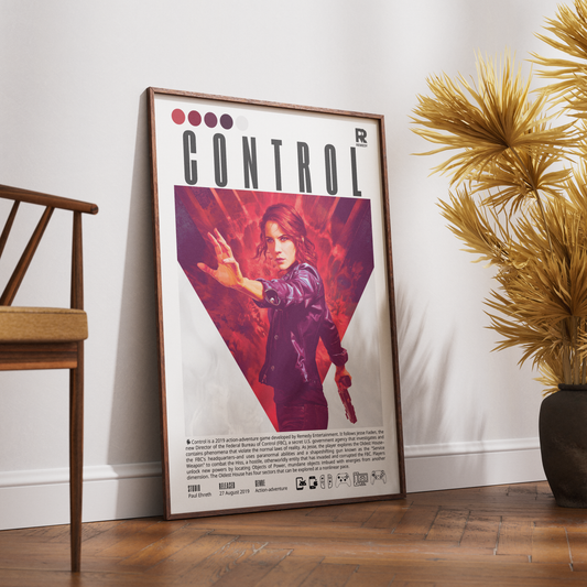 A framed poster of the video game Control leaning against a white wall on a wooden floor, styled with a wooden chair on the left and a potted plant on the right.