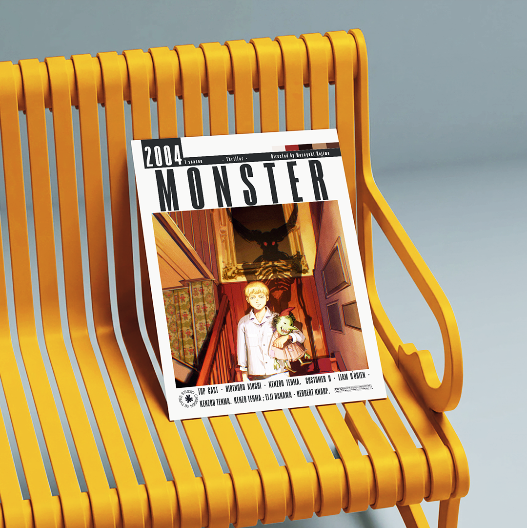 A 2004 comic book titled 'Monster' is displayed on a bright yellow slatted bench against a soft gray background.