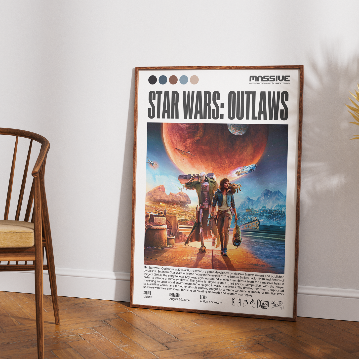 A framed vertical poster of the video game Star Wars: Outlaws leaning against a white wall on a wood floor, with part of a wooden chair visible on the left.