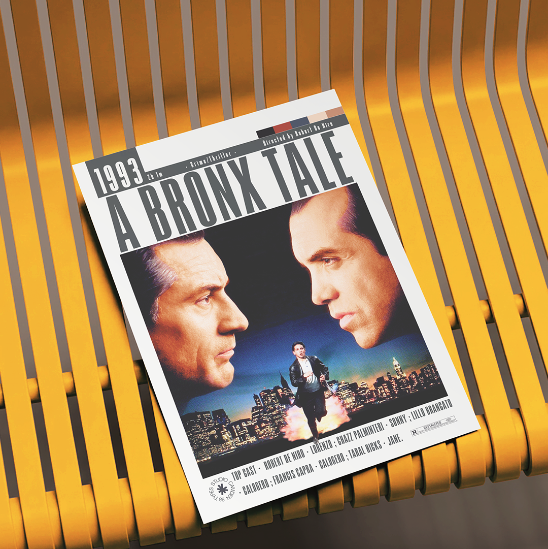 A 1993 film poster for 'A Bronx Tale' displayed on a yellow slatted bench. The poster features a white border with the title in bold black letters and a central image showing two men's faces and a city skyline.