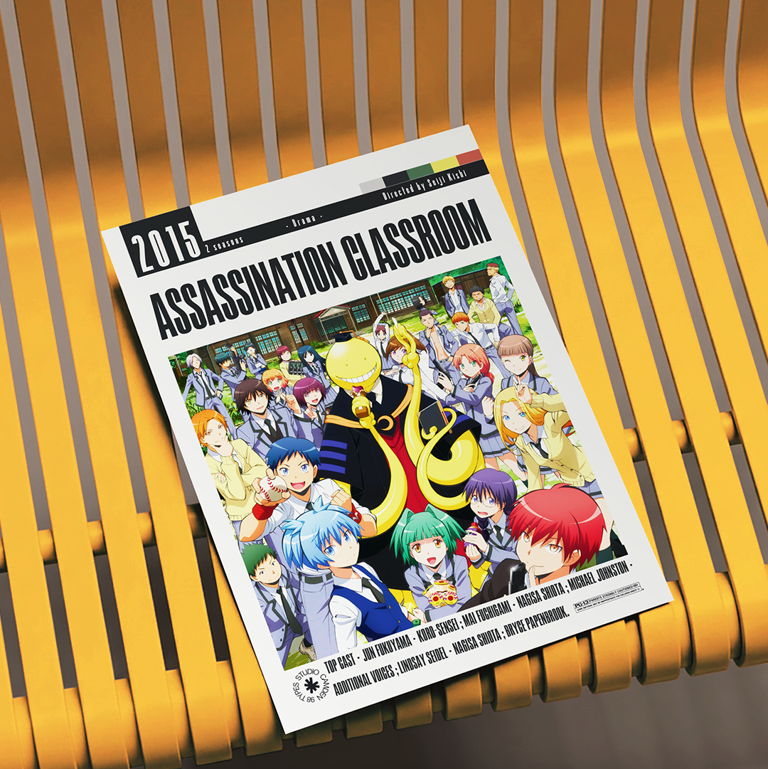 A printed magazine or book cover titled "Assassination Classroom" lies on a yellow slatted chair. The cover features a large anime illustration with multiple characters and the text "2015 Edition" and "Assassination Classroom" prominently visible.