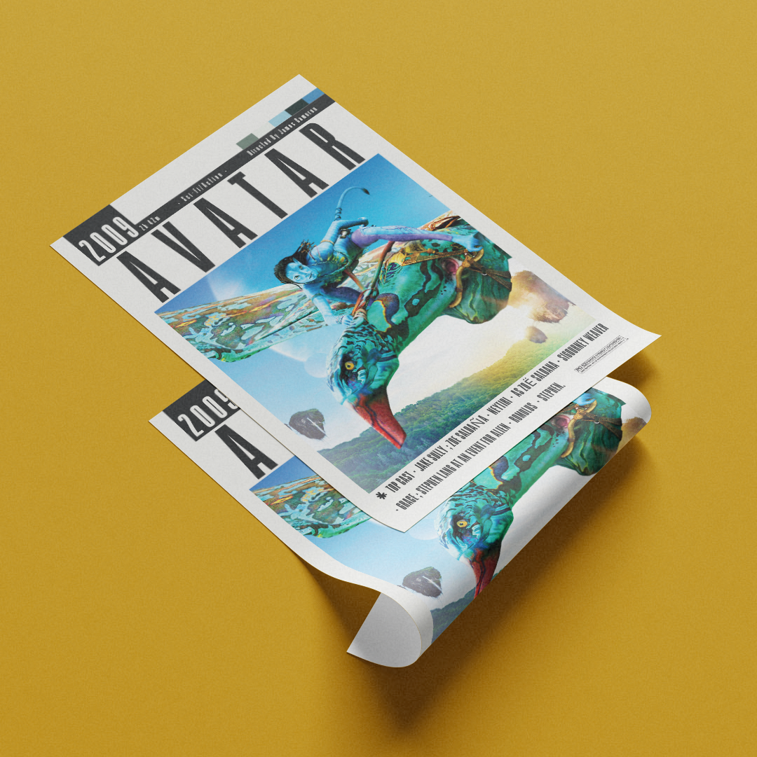 A rolled-out magazine or poster featuring the 'Avatar' cover art, displayed diagonally on a solid mustard yellow background.