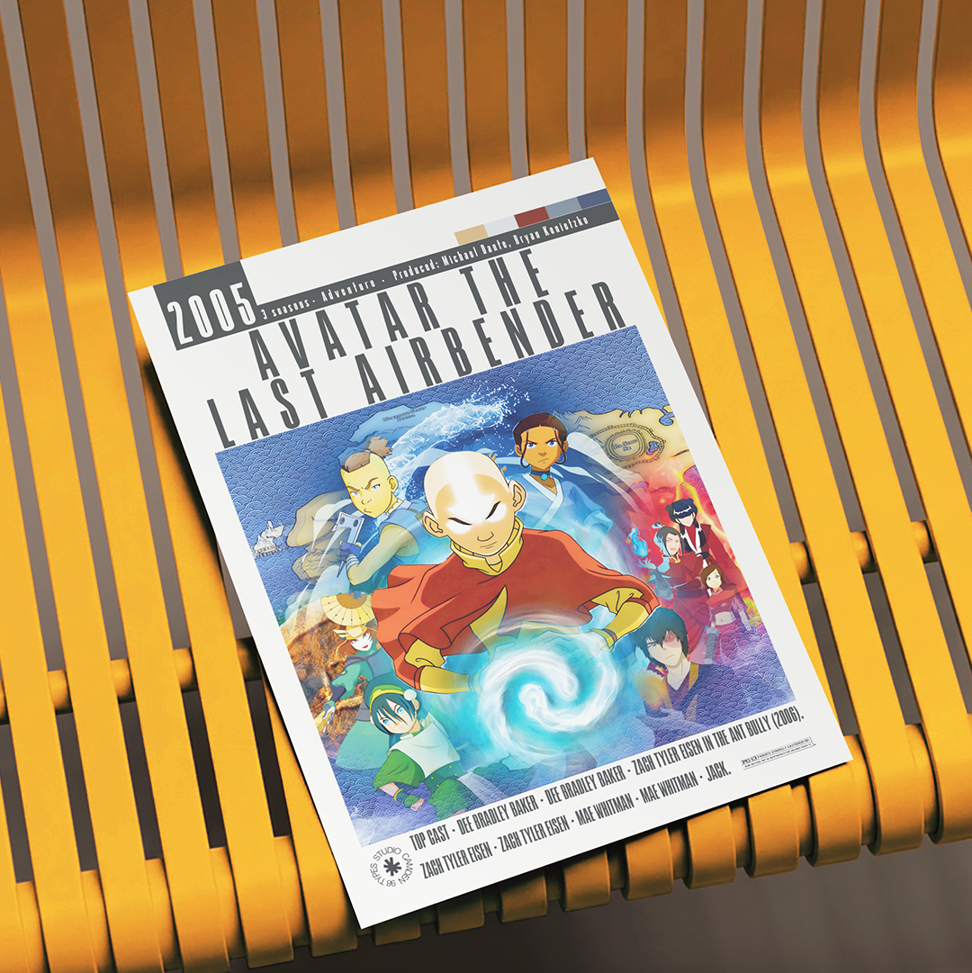 A printed poster or art print for the 2005 film Avatar: The Last Airbender, featuring illustrated characters and title text, photographed resting on a yellow slatted bench.