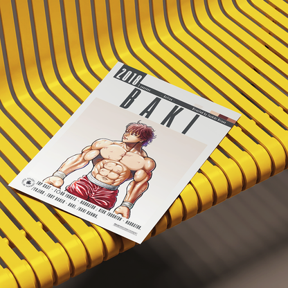 A magazine or book titled "BAKI" with an illustrated muscular male character on the cover, placed on a bright yellow ribbed bench.