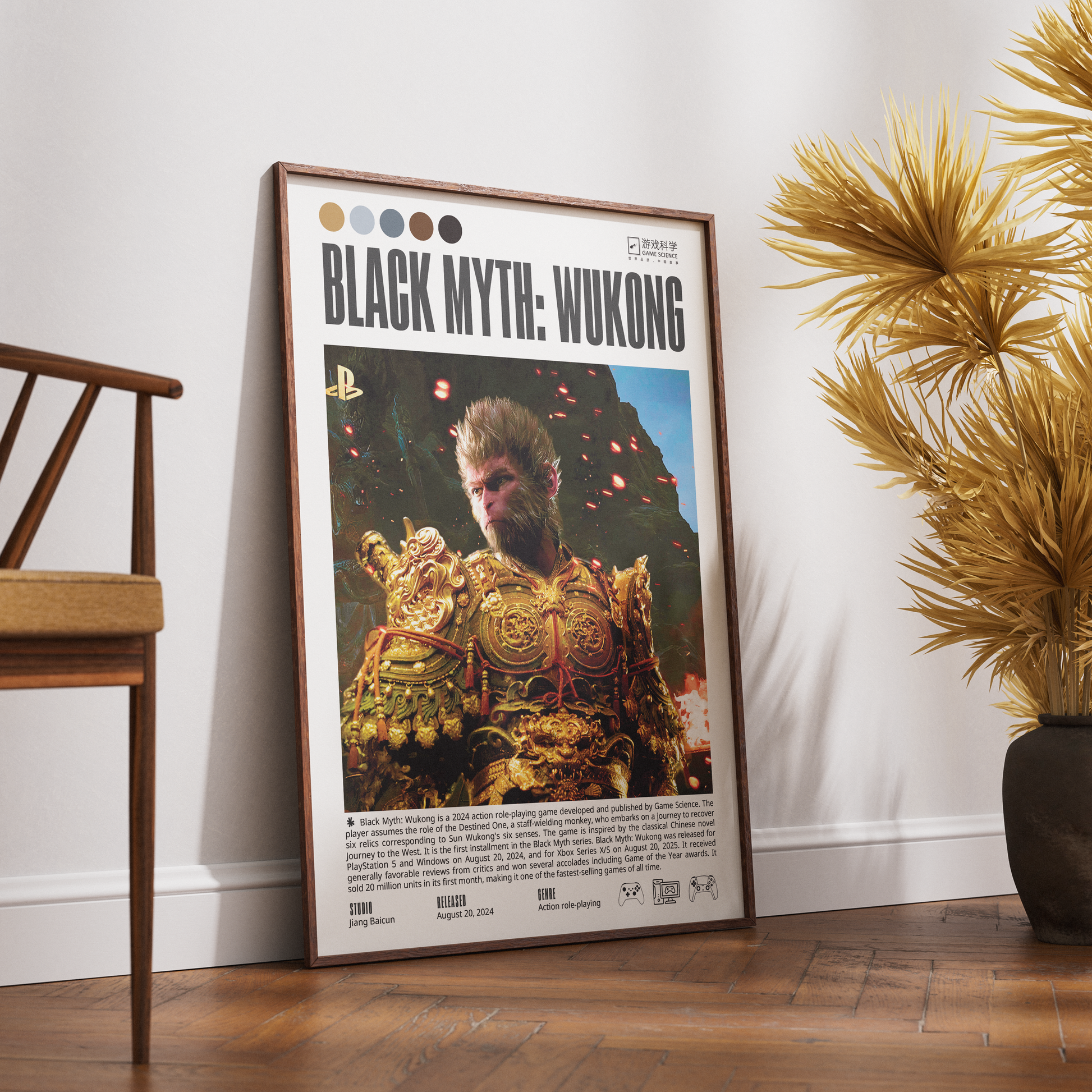 A framed vertical poster of the video game Black Myth: Wukong leaning against a white wall on a wooden floor, styled in a room with a wooden chair on the left and a potted plant on the right.