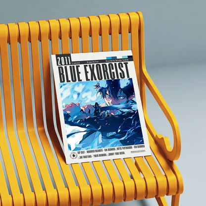 A copy of the 2017 comic book Blue Exorcist rests on a modern yellow slatted bench against a neutral gray background.