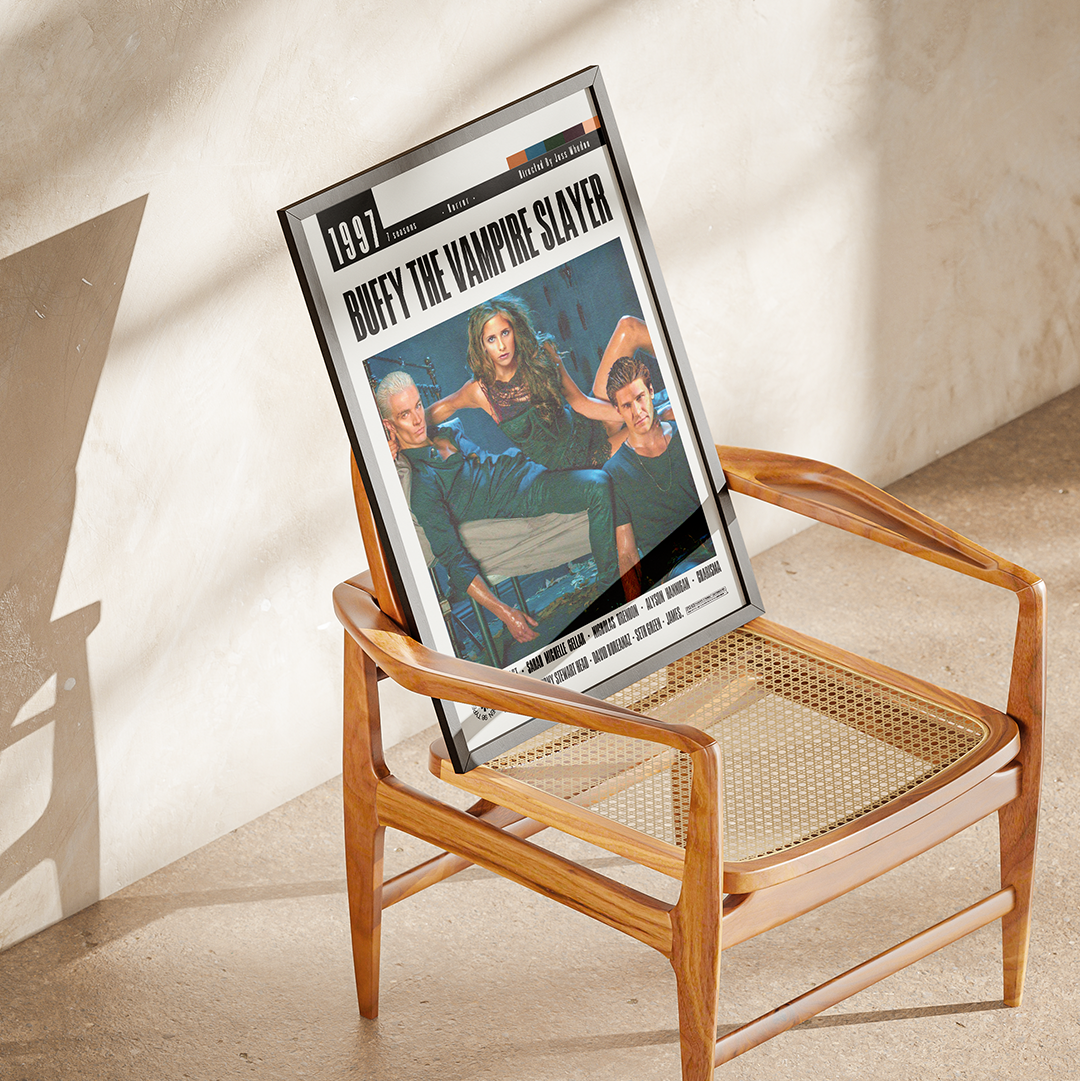 A framed vintage magazine or newspaper cover leaning against a wooden armchair in a sunlit room. The visible cover reads '1997' and 'DUFFY THE VAMPIRE SLAYER,' with a photo of three people on the front.