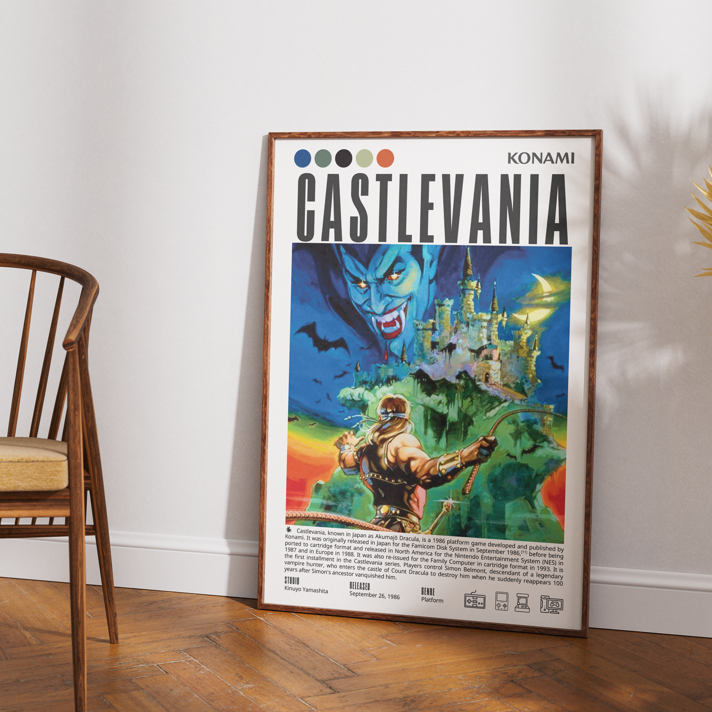 A framed vintage-style Konami Castlevania poster leaning against a white wall on a wood floor, with part of a wooden chair visible on the left.