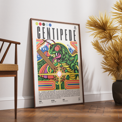 A framed Centipede music poster leaning against a white wall on a wooden floor, next to a wooden chair and a potted palm plant.