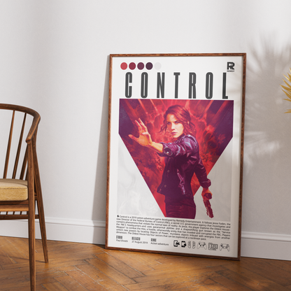 A framed 'Control' movie poster leaning against a white wall on a wooden floor, next to a wooden chair.