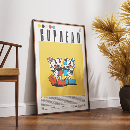 A framed Cuphead poster leaning against a white wall on a wooden floor, with a wooden chair on the left and a potted palm on the right.