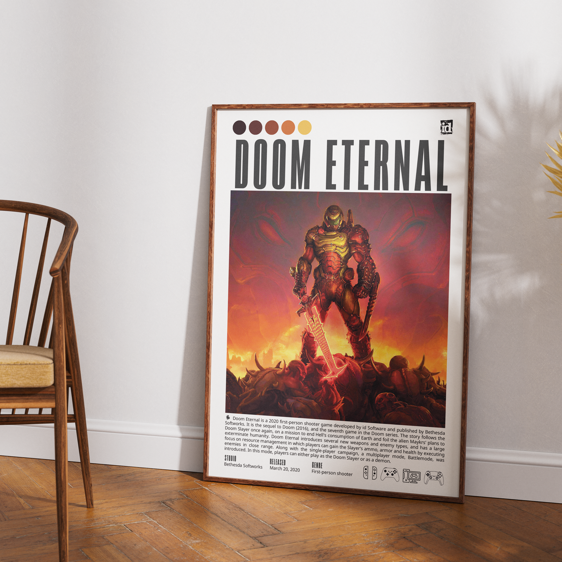 A framed Doom Eternal poster leaning against a white wall on a wooden floor, with part of a wooden chair visible on the left.