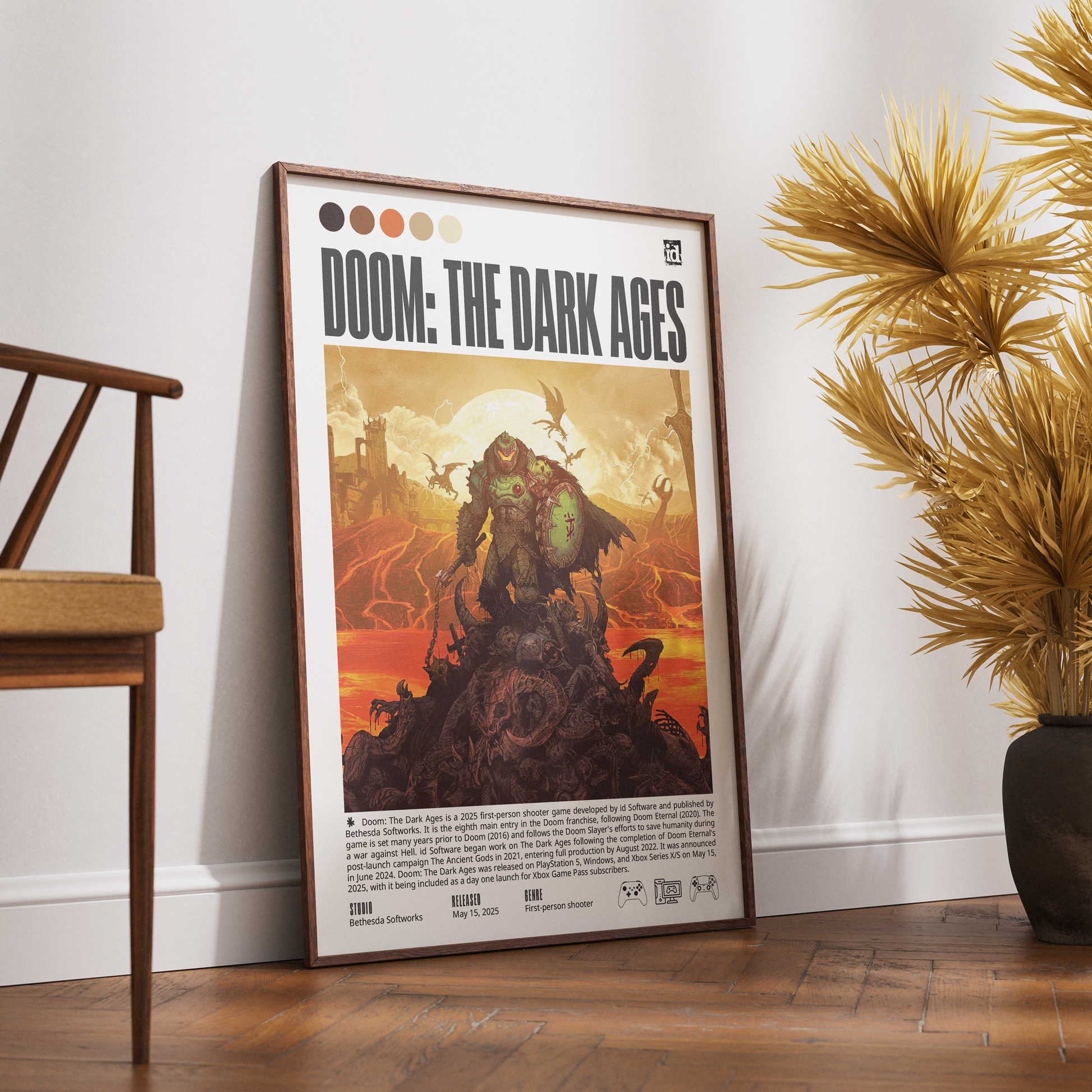 A framed 'Doom: The Dark Ages' poster leaning against a white wall on a wooden floor, with a wooden chair on the left and a potted palm on the right.