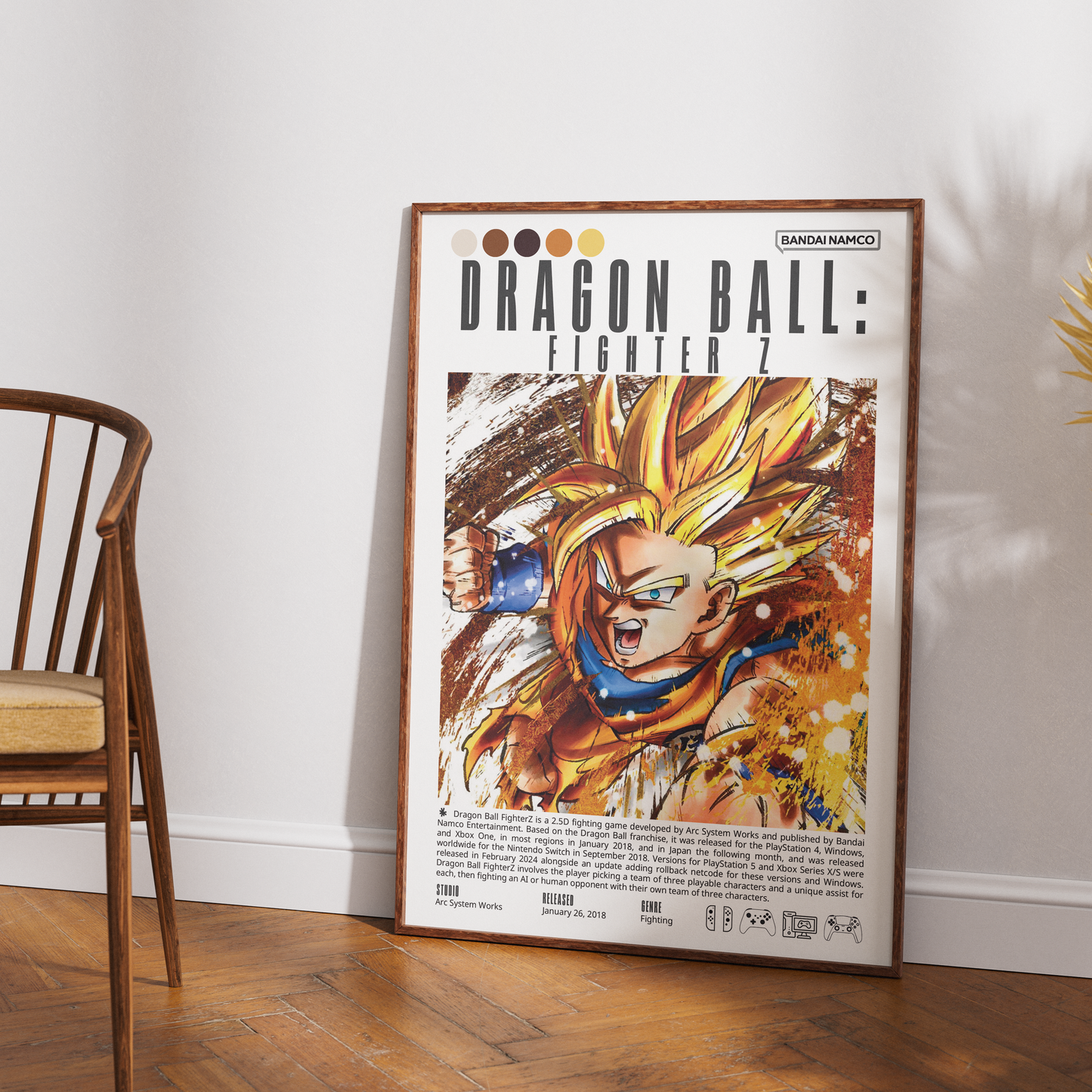 A framed Dragon Ball: Fighter Z art print leaning against a white wall on a wooden floor, with part of a wooden chair visible on the left.