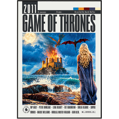 A Game of Thrones 2011 poster print featuring a dramatic illustration of a dragon flying over a burning castle on a rocky island, with a woman in a blue cloak standing on the shore in the foreground. The title 'GAME OF THRONES' is printed prominently at the top, with the year '2011' and production credits at the bottom.