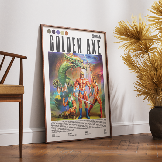 A framed retro-style 'Golden Axe' poster leaning against a white wall on a wooden floor, with a wooden chair on the left and a potted palm on the right.