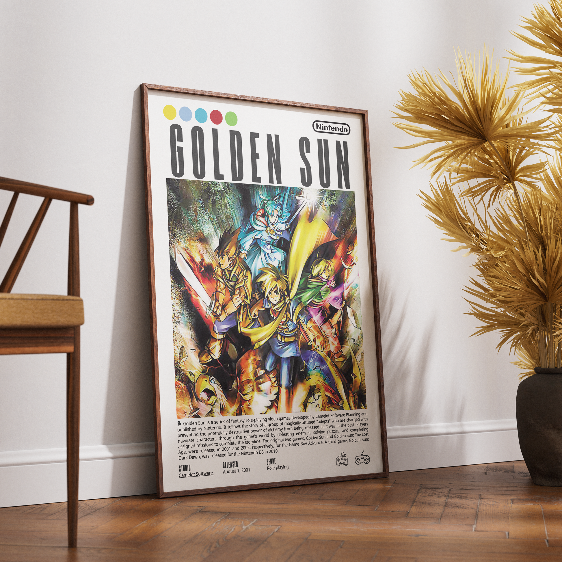 A framed Golden Sun video game poster leaning against a white wall on a wooden floor, with a wooden chair on the left and a potted palm on the right.