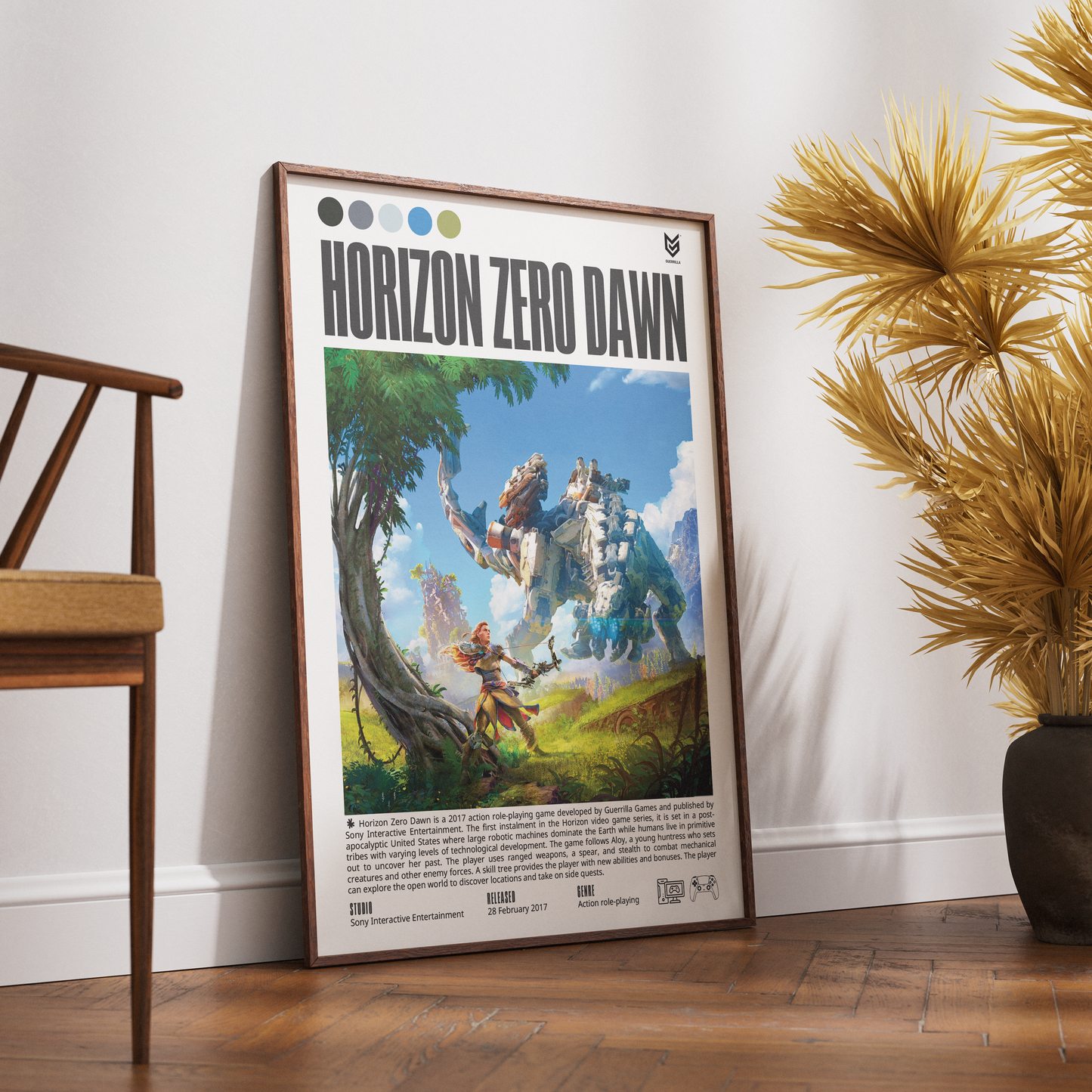 A framed Horizon Zero Dawn poster leaning against a white wall on a wooden floor, with a wooden chair on the left and a potted palm on the right.