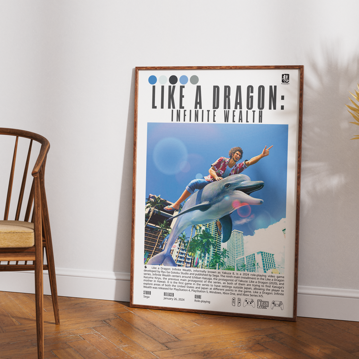 A framed poster leaning against a white wall on a wood floor, next to a wooden chair. The poster reads 'LIKE A DRAGON: INFINITE WEALTH' and features an illustration of a person riding a dolphin against a blue sky with buildings.