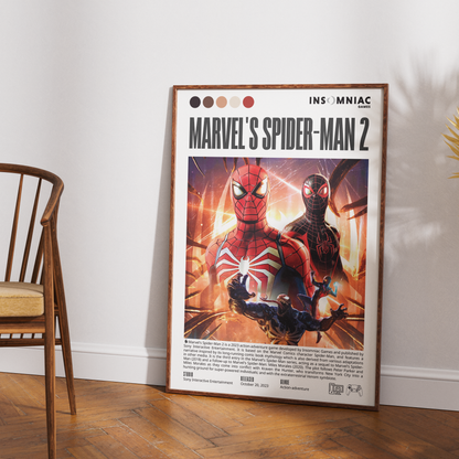 A framed Marvel's Spider-Man 2 movie poster leaning against a white wall on a wooden floor, with part of a wooden chair visible on the left.