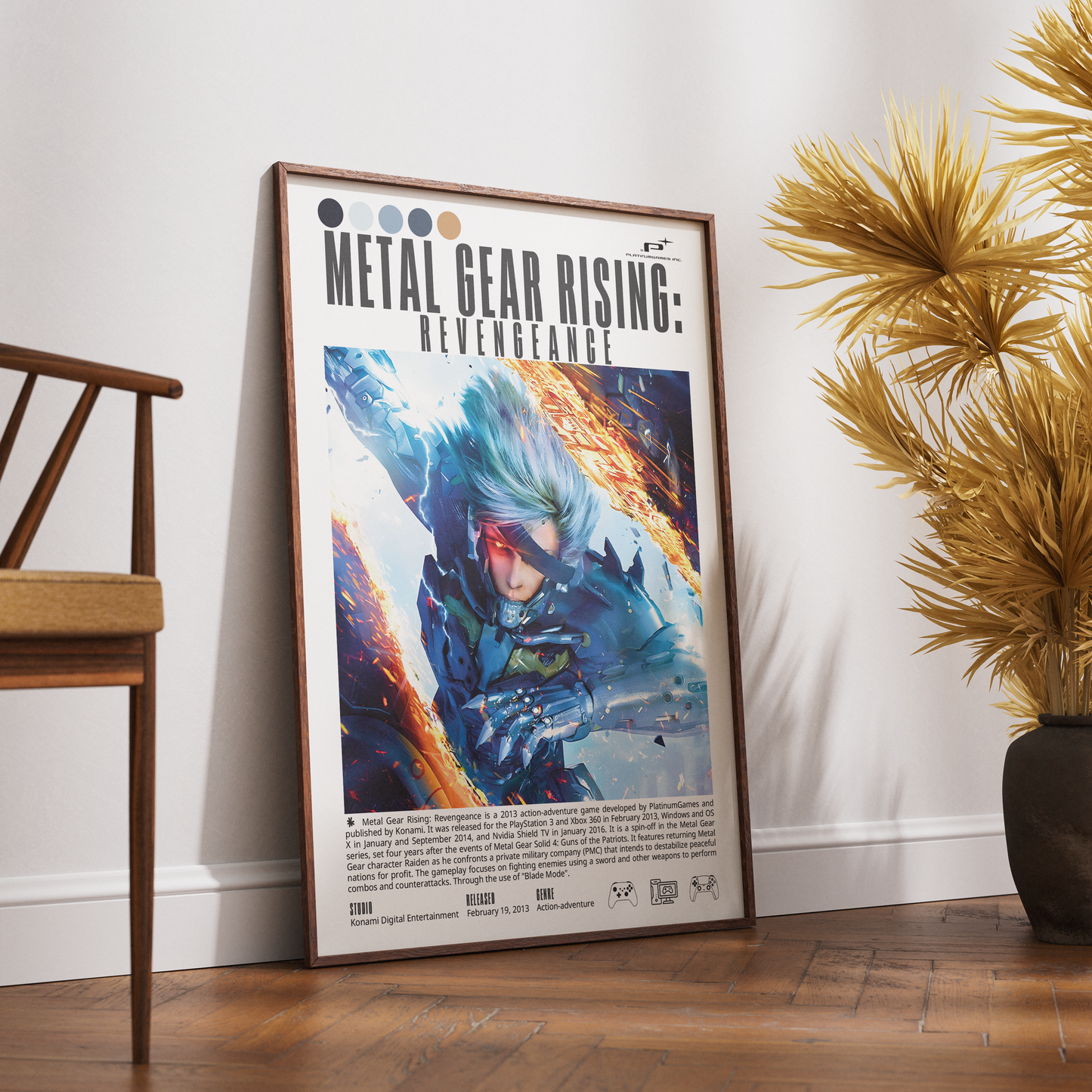 A framed Metal Gear Rising: Revenance poster leaning against a white wall on a wooden floor, styled in a room with a wooden chair on the left and a potted palm on the right.