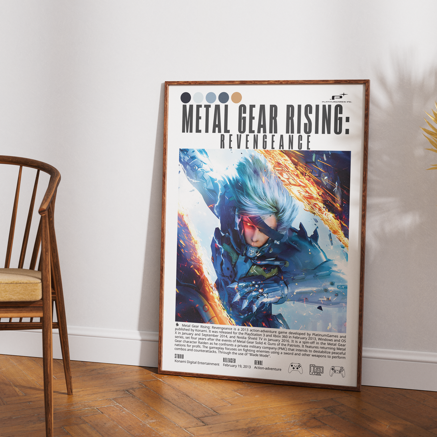 A framed Metal Gear Rising: Revengeance art print leaning against a white wall on a wooden floor, next to a wooden chair.