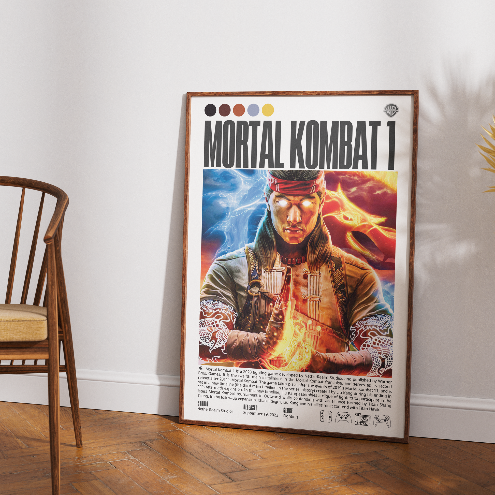 A framed Mortal Kombat 1 poster leaning against a white wall on a wooden floor, with part of a wooden chair visible on the left.