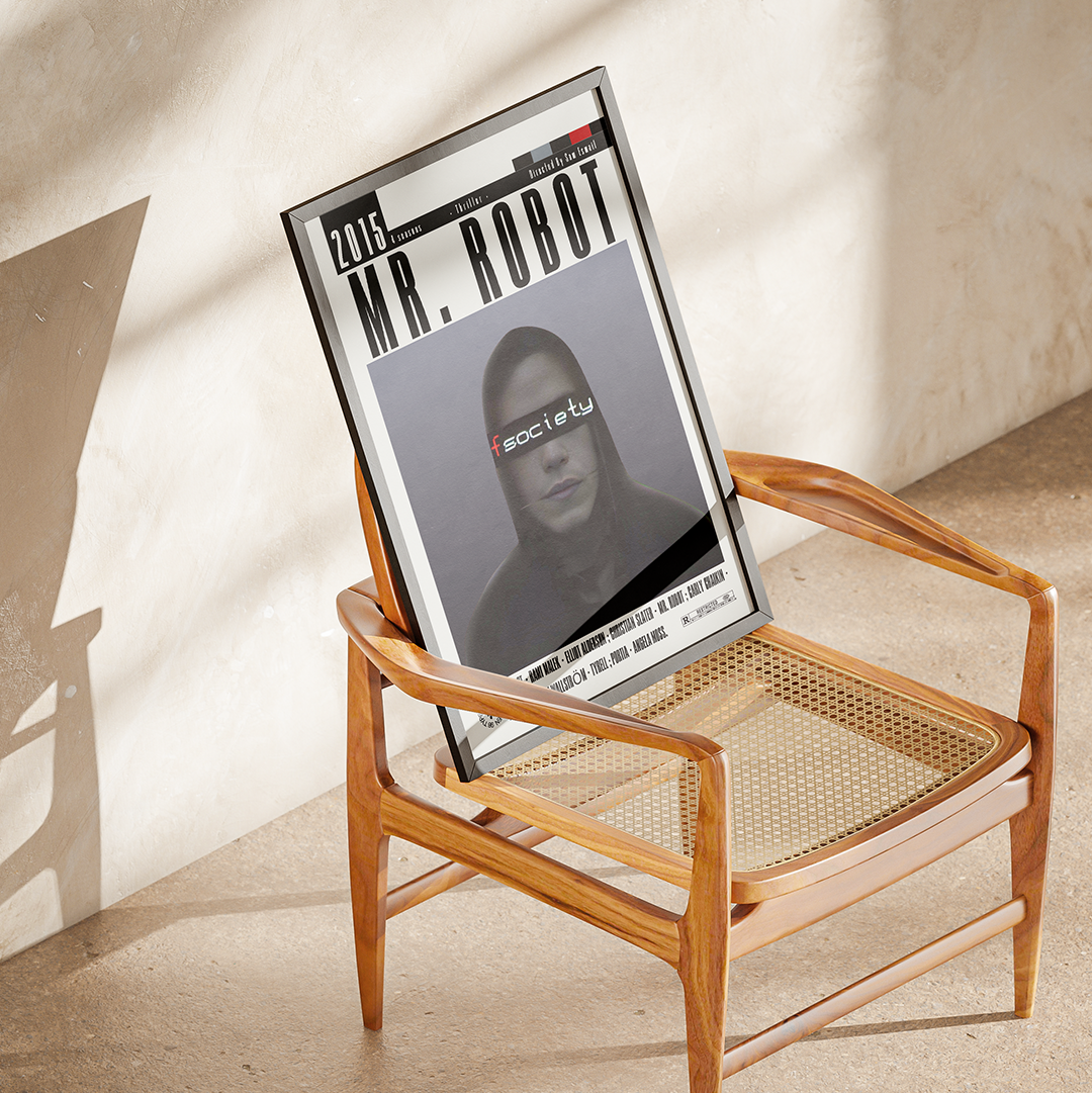 A framed poster featuring the text '2019 MR. ROBOT' and a monochrome portrait with 'societátu' across the eyes, leaning against a mid-century wooden armchair in a sunlit room.