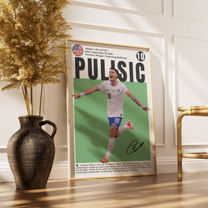 A framed poster of soccer player Patrick Mulligan, styled in a warm, modern interior setting with a dark ceramic vase containing dried pampas grass on a wooden floor.