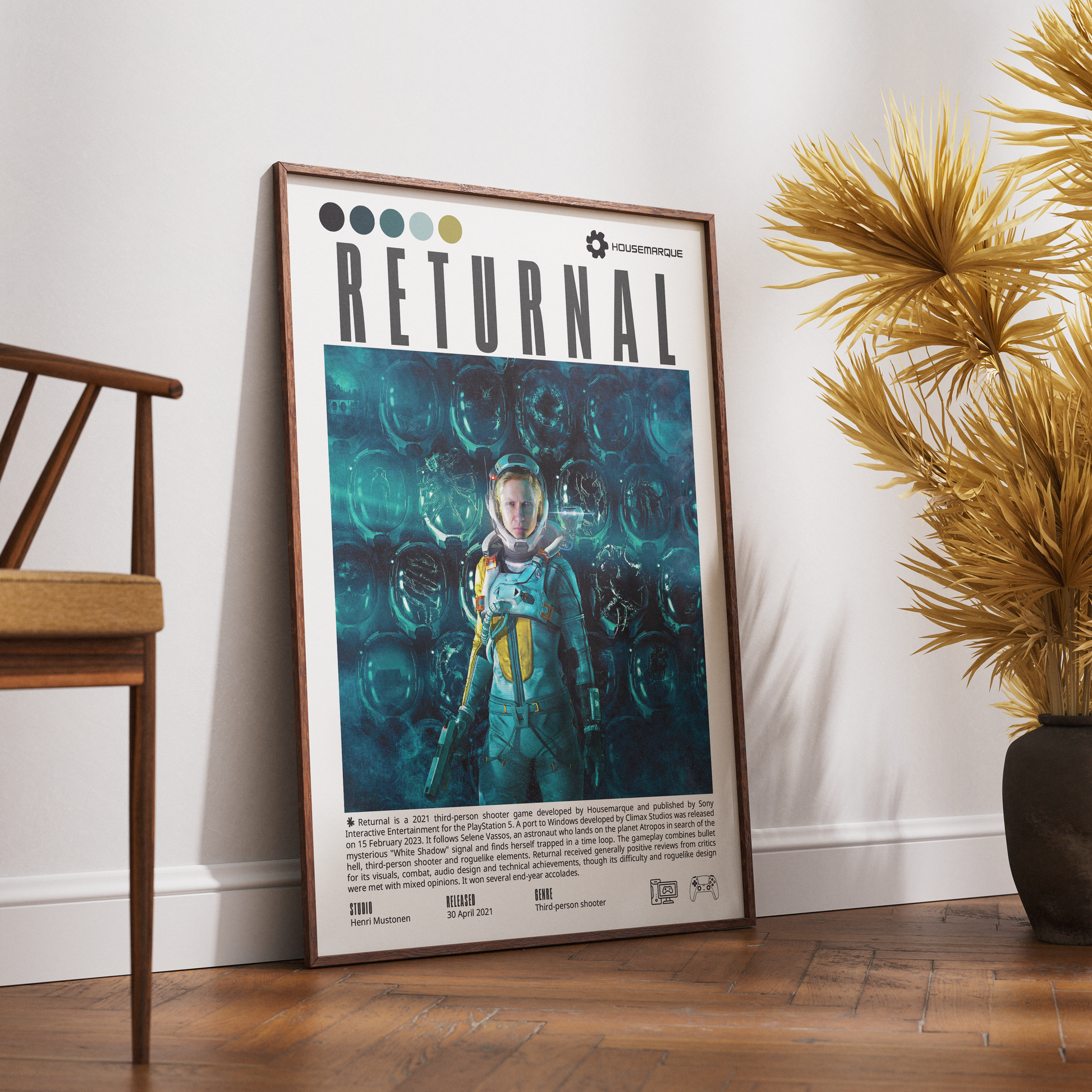 A framed poster titled 'RETURNAL' leaning against a white wall on a wooden floor, styled in a room with a wooden chair on the left and a potted palm on the right.