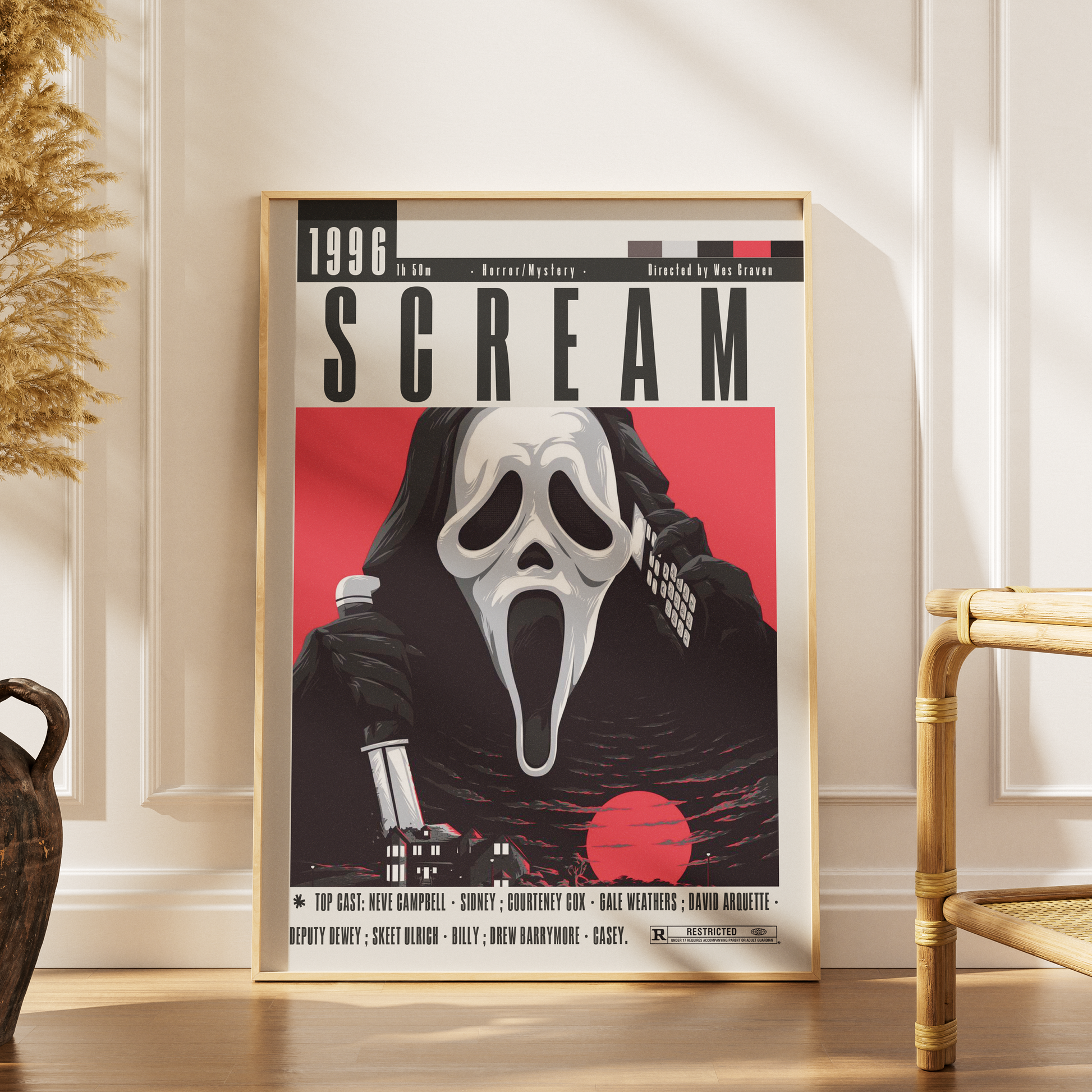 Framed 'Scream' movie poster on a wall with decorative elements.