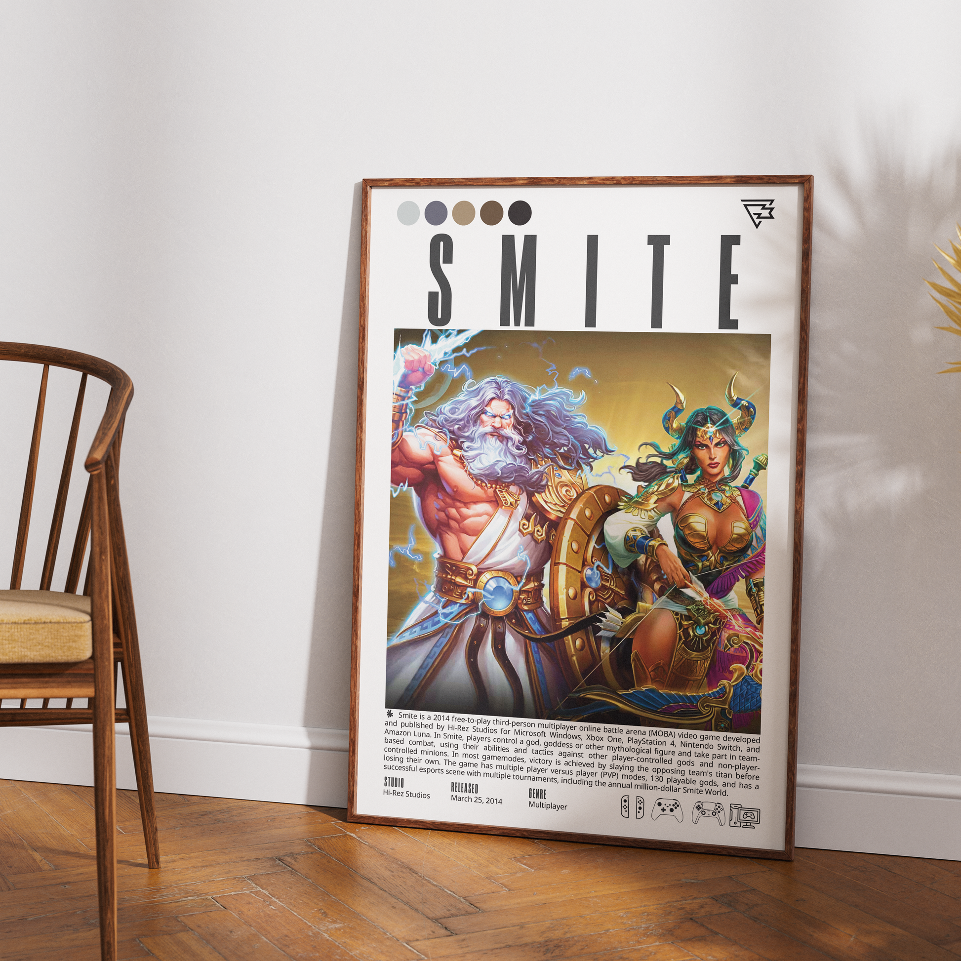 A framed art print featuring a colorful illustration of Norse gods Thor and Freyja under the title 'SMITE', leaning against a white wall on a wooden floor next to a wooden chair.