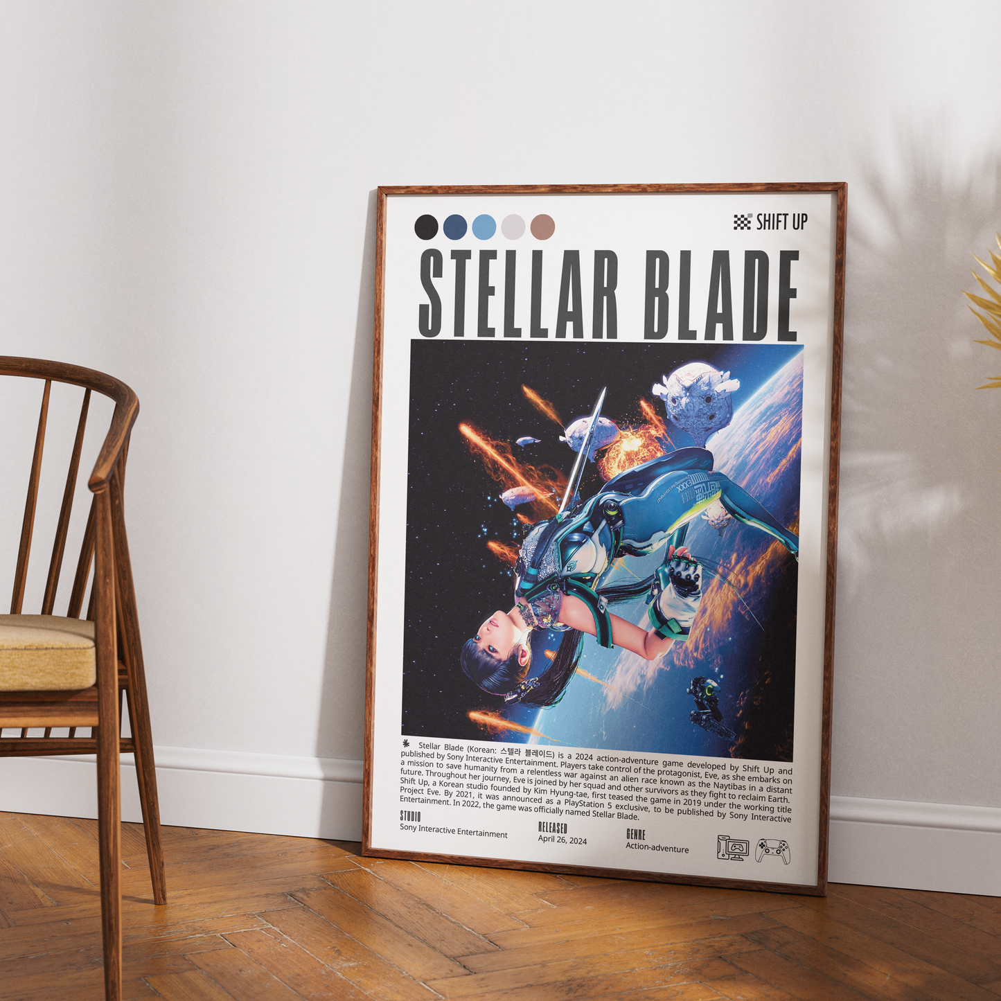 A framed retro sci-fi poster titled 'Stellar Blade' leaning against a white wall on a wood floor, next to a wooden chair.