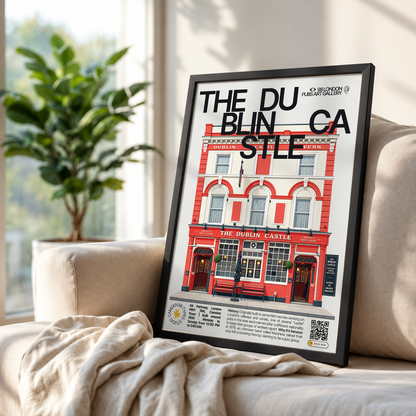 A framed art print leaning against a beige sofa in a living room setting. The print features a stylized illustration of 'The Dublin Castle' pub with the text 'THE DU BLIN CA STLE' across the top.