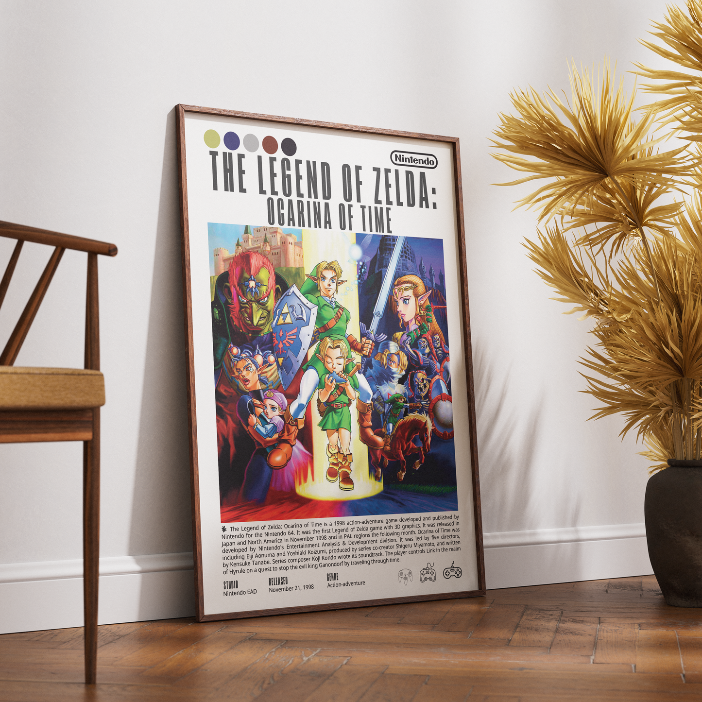 A framed retro-style poster of The Legend of Zelda: Ocarina of Time leans against a white wall on a wooden floor, with part of a wooden chair on the left and a potted palm on the right.