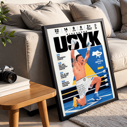 A framed poster print leaning against a beige sofa in a living room setting. The poster features a stylized boxing-themed cover with the name 'OLYUK' at the top, a shirtless boxer kneeling in a ring with arms raised, and multiple years listed on the left side.