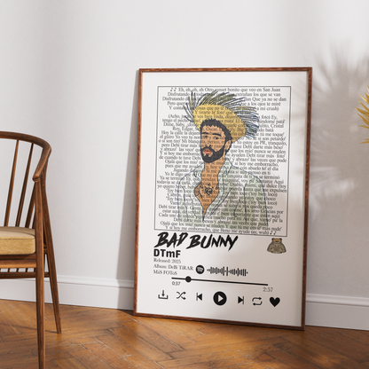 A framed music-themed art print leaning against a white wall on a wooden floor, next to a wooden chair. The print features a stylized portrait of Bap Bunny with a feathered hat, set against a background of song lyrics, with 'BAP BUNNY' and 'DTMF' printed at the bottom.