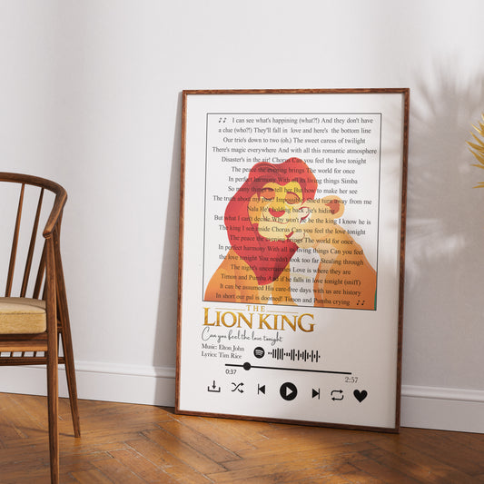 A framed personalized Lion King movie quote print leaning against a white wall on a wooden floor, next to a wooden chair.